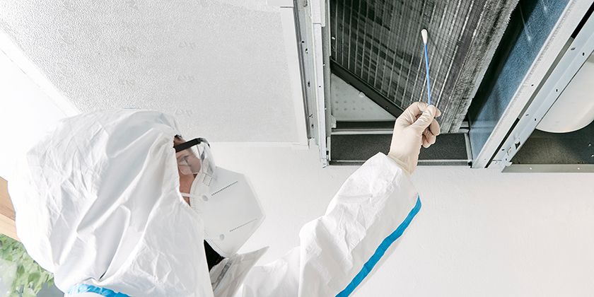 AIRsana technician conducts a swab test on an air conditioning system